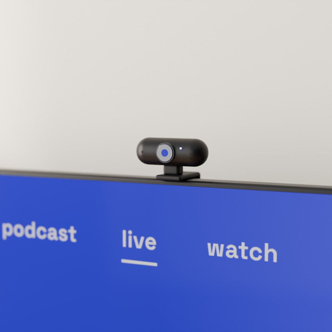 The skriin camera clipped onto the top edge of a TV